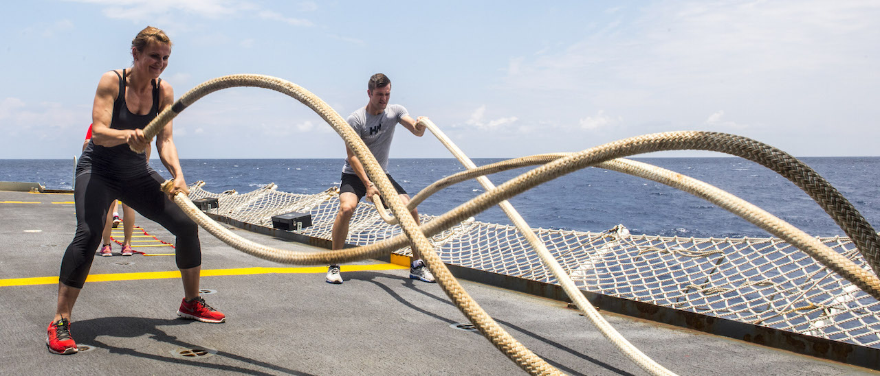 Chief Petty Officer Second Class (CPO2) Monika Quillan (left) and Sub-Lieutenant (SLt) Marc Flynn (right), of Her Majesty's Canadian Ship (HMCS) ATHABASKAN, perform rope drills as part of a physical fitness class on the flight deck, while on Op Caribbe, May 2, 2015 Operation Caribbe is Canada's contribution to Operation MARTILLO, a US Joint Interagency Task Force South (JIATF-S) operation.  JIATF-S is a US National task force responsible for conducting interagency and regional security operations and facilitating the interdiction of illicit trafficking of drugs, weapons, money and personnel. Image By: Corporal Anthony Chand   Formation Imagery Services   © 2015 DND-MND Canada